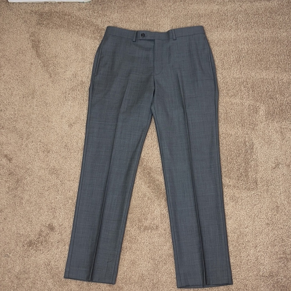 Dress slacks in grey for men by Calvin Klein.  Size 33w x 30 L slim fit.